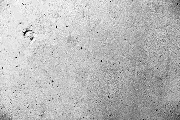 Texture of a concrete wall with cracks and scratches which can be used as a background