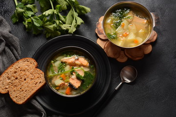 Fresh fish soup on black background