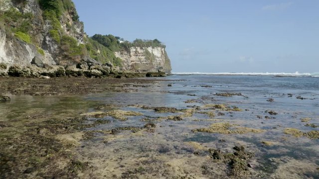 Drone Shot flyng above the dry reef in Uluwatu Bali indonesia