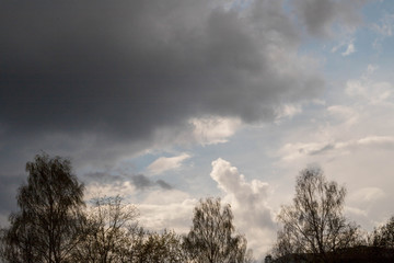 Obraz na płótnie Canvas blue sky with white and grey rain clouds