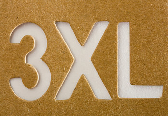 XXXL stencil on cardboard texture