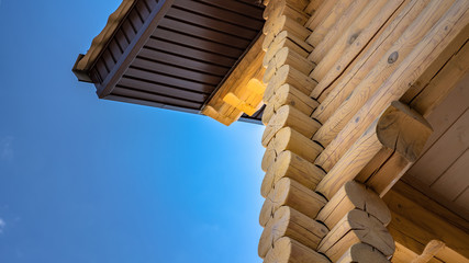 house made of logs perspective view of the background of the sky fragment, wood construction