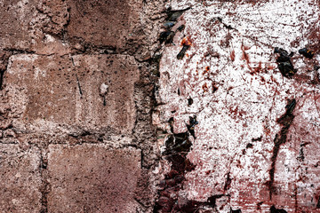 Texture of a concrete wall with cracks and scratches which can be used as a background