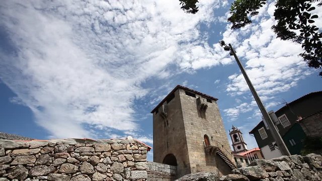 Wide shot of Stone Castle tower in Ucanha with blue sky in Portugal