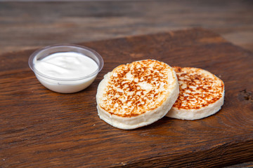 Cottage cheese pancakes with sweet sauce, breakfast food