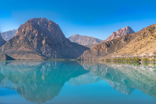 The scenic view of Iskanderkul lake and Fann mountains in Tajikistan