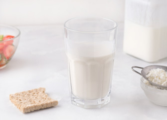 Fermented milk product drink kefir in a glass on a white background. Healthy drinks