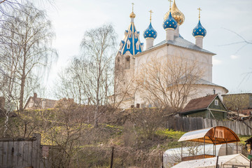 temple Church on the hill through the trees