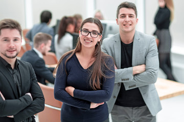 smiling young business woman standing in the office