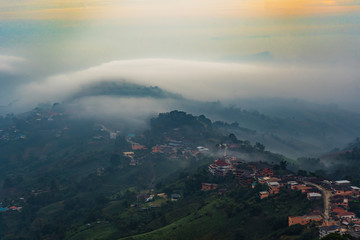 Beautiful Landscape of mountain layer in morning sun ray and winter fog at Mae Salong Nai, Chiangrai, Thailand