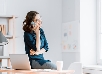 woman working on a laptop at home.