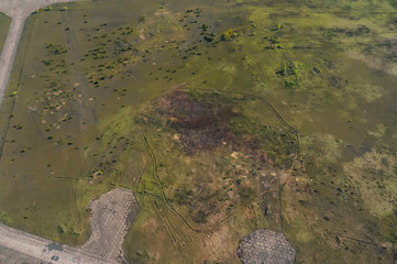 Aerial view of idyllic rolling patchwork farmland with pretty wooded boundaries