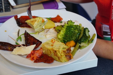 Typical Italian appetizer with Parmesan cheese, ham, frittata, grilled paprika broccoli and other vegetables
