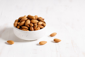 Fresh Almond nuts in a ceramics bowl