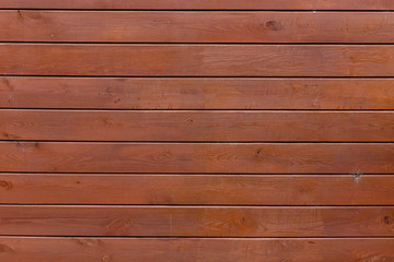 Wooden fence or wooden wall with glaze or oil tint or stain