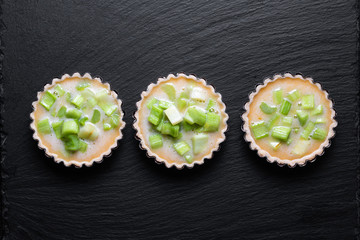 Home cooking concept top view Homemade organic Rhubarb pie on black slate stone board
