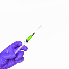 Doctor hand hold syringe in purple glove. Injection yellow vaccine concept. Medical injector for science test. Close up health care vaccination. Therapy drug surgery banner with copyspace