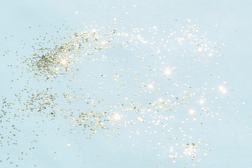 gold shiny glitter on blue background