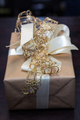 gift with gold and white bows