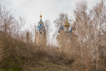 temple Church on the hill through the trees