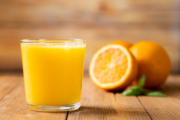 Shot of Fresh Orange Juice in a Glass.