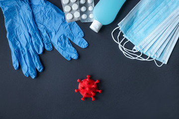 sterile mask gloves sterilizer disinfector on a dark background