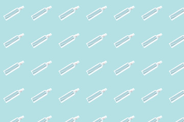 Transparent hand sanitizer in the transparent spray bottle on the plain background virus caution actions mint color