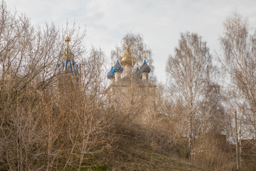 temple Church on the hill through the trees