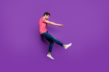Fototapeta na wymiar Full length profile side photo of minded guy jump wind blow he fall fly lose gravity weightlessness wear good look clothes gumshoes isolated over bright color background