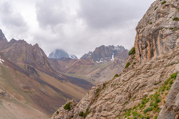 The beautiful view of blue sky and snow mountain summit near to Zmeya peak in Fann mountains in Tajikistan