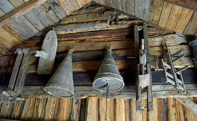 Old tools in log cabin interior 