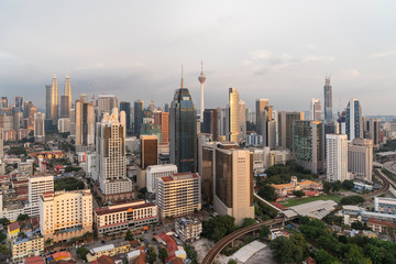 Panoramic view of Kuala Lumpur skyline at sunset. City center of capital of Malaysia. Contemporary buildings exterior with glass.