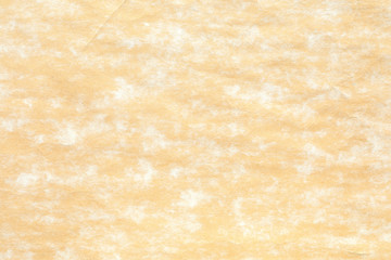 Old yellow paper with white stain  