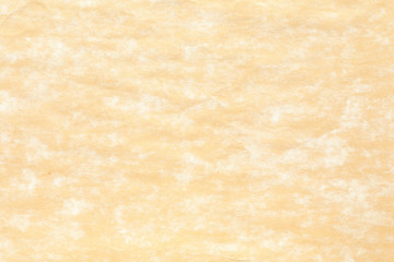 Obraz premium Old yellow paper with white stain 