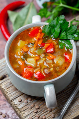 Homemade lentil soup with vegetables close-up.
