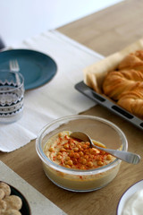 Bowl of homemade hummus served on a table. Selective focus.