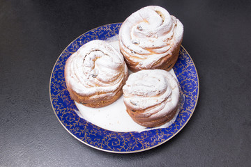 plate with homemade bakery on black table