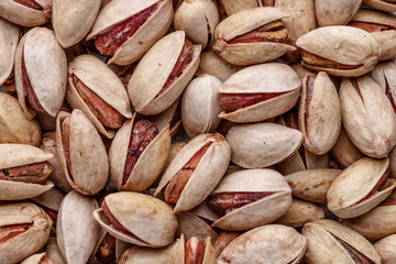 Pistachios texture and background . Tasty pistachios as background,as pistachios texture.Concept of nuts. flat lay
