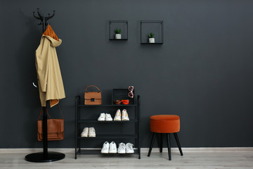 Hallway interior with stylish furniture, clothes and accessories