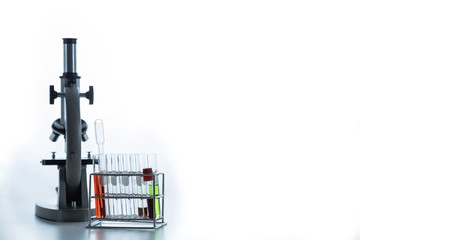 Blood sample and vaccine in test tube selective focus. Lab glassware science equipment. Science laboratory research, pharmaceutical, scientific research  and development concept. copy space for text