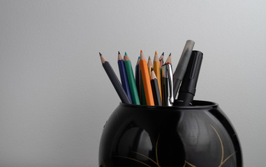 Set of colored pencils in the black vase isolated on white background design, pattern, school, office, art, paper, wooden, pencil, group