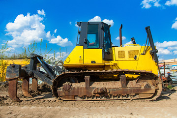 the bulldozer is located on a construction site
