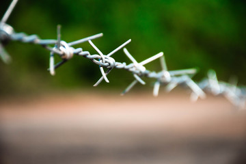 Barbed wire seamless.The old prison is surrounded by barbed metal wire