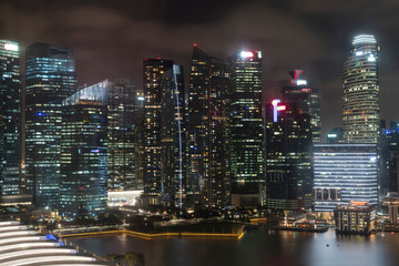 Picturesque panoramic view of Singapore city at night time. Financial and trading center hub in Asia region. Concept of success. Modern buildings in high-tech world.