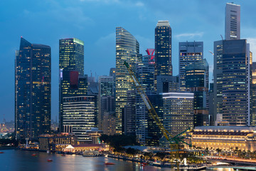 Fototapeta na wymiar Picturesque panoramic view of Singapore city at sunset. Financial and trading center hub in Asia region. Concept of success. Modern buildings in high-tech world.