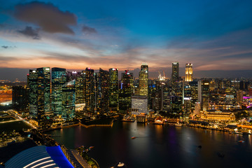 Fototapeta na wymiar Picturesque panoramic view of Singapore city at sunset. Financial and trading center hub in Asia region. Concept of success. Modern buildings in high-tech world.