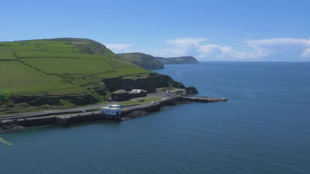 Panning shot of Isle of Man Port Erin port and coastline 