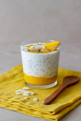 Yogurt in a glass with mango, chia and almonds. Healthy eating. Vegetarian food. Recipe. Breakfast. Diet.