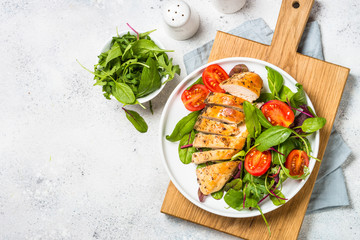 Chicken fillet with salad top view.