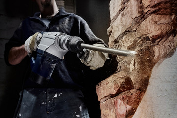 Construction Worker with Powerful Hammer Drill